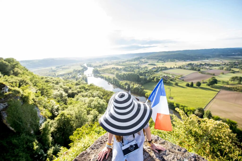 Woman in front of a beautiful french landscape