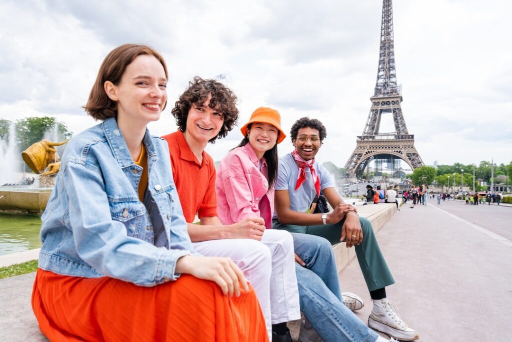 group of young happy students in paris